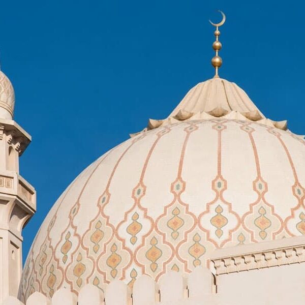 Moroccan trellis custom mosaic pattern in neutral colors on a Mosque dome. The beige and cream accented with a hint of yellow. Sultan Qaboos Grand Mosque