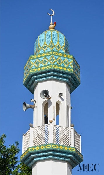 Middle Eastern Islamic glass mosaic tile pattern with rich aqua and green hues. Mosaic cladded on a Mosque Minaret. Custom handcrafted by MEC.