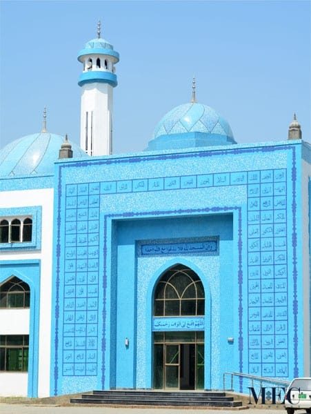 Mosque enterance calligraphy mosaic art showing Asma ul Husna or the divine names of God. The domes have a contemporary glass mosaic design. Custom handcrafted by MEC