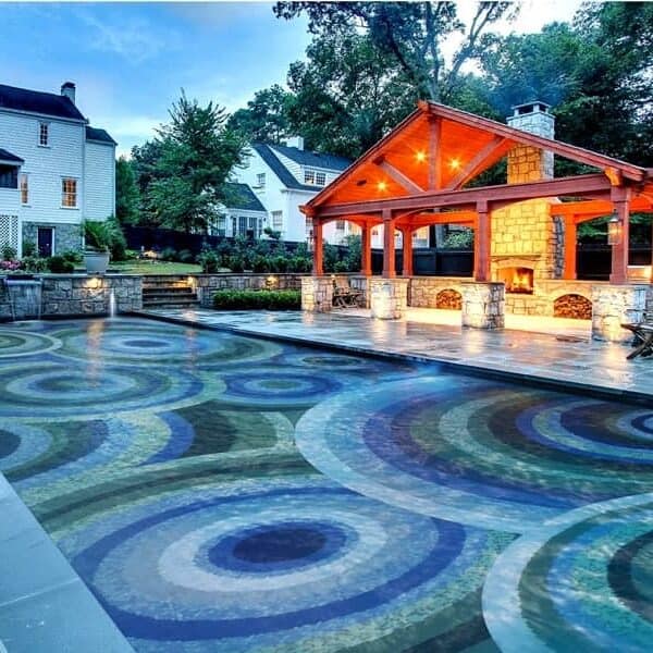 Custom Pool Mosaics by MEC | Vibrant concentric overlapping circles glass mosaic swimming pool.