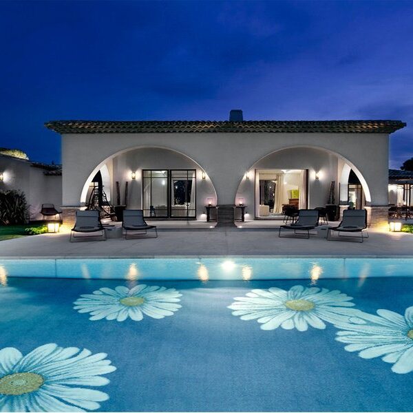 Custom Pools by MEC | Glass mosaic pool design featuring classic yellow and white daisies.