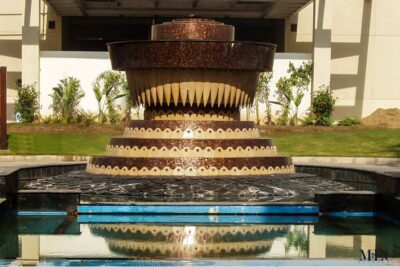 Custom Mosaics by MEC | Cream and brown tile fountain cladded with glass mosaic tile design.