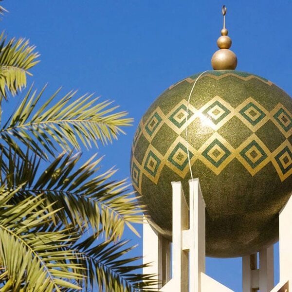 A contemporary Mosque Minaret. Sphere Minaret cladded with green and 24 K gold foiled glass mosaic tiles. Modern Islamic art. Custom handcrafted by MEC.