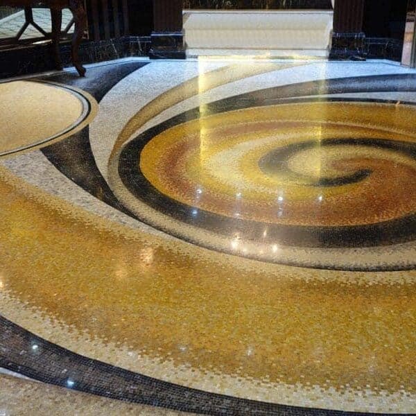 Custom Mosaics by MEC | Handcrafted marble mosaic swirl floor pattern.