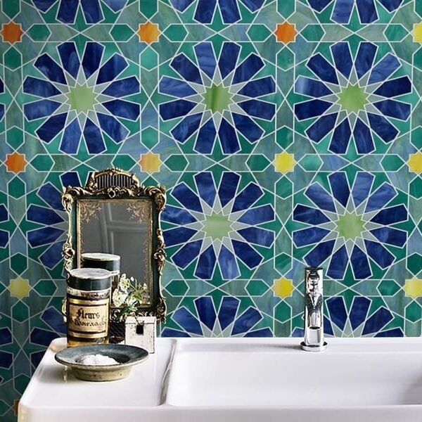 ARYN. Product image showing Jade Glass waterjet cut tiles from Marrakesh collection. Custom blue green geometric Arabesque Moroccan tile design from MEC.