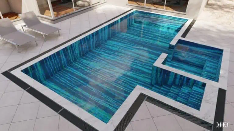 Modern swimming pool with a dynamic blue and teal striped mosaic tile design and surrounding patio.