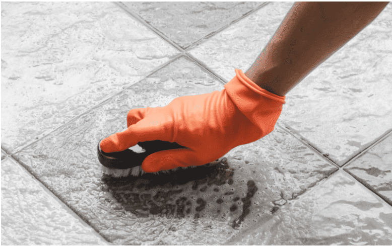 mosaic floor being cleaned with soft sponge