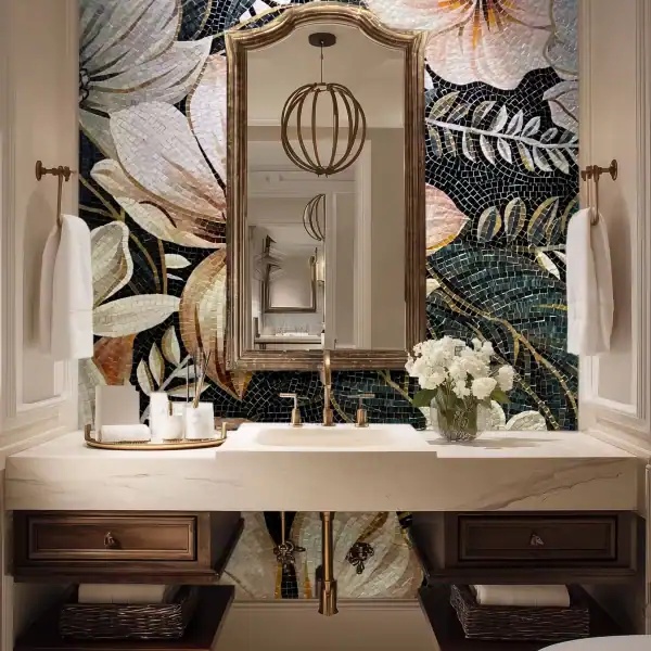 Bathroom wall mosaic mural with large floral patterns in soft ivory, blush, and gold tones against a dark background, made from glass mosaic tiles.