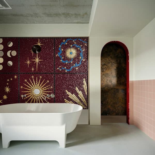Eternal Universe Mosaic Cosmic bathroom mosaic wall featuring golden suns, moons, and star motifs on a deep burgundy backdrop, creating a celestial and artistic focal point.