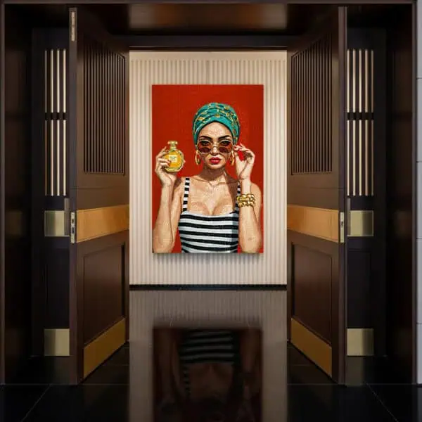 Modern Glam Mosaic Portrait Handmade mosaic portrait mural of a glamorous woman in striped attire with bold accessories, sunglasses, and a perfume bottle, set against a vibrant red background.