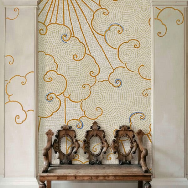 The Clouds & Sun Mosaic Bathroom mosaic wall featuring a golden sunburst with celestial stars on a teal sky above a freestanding bathtub.