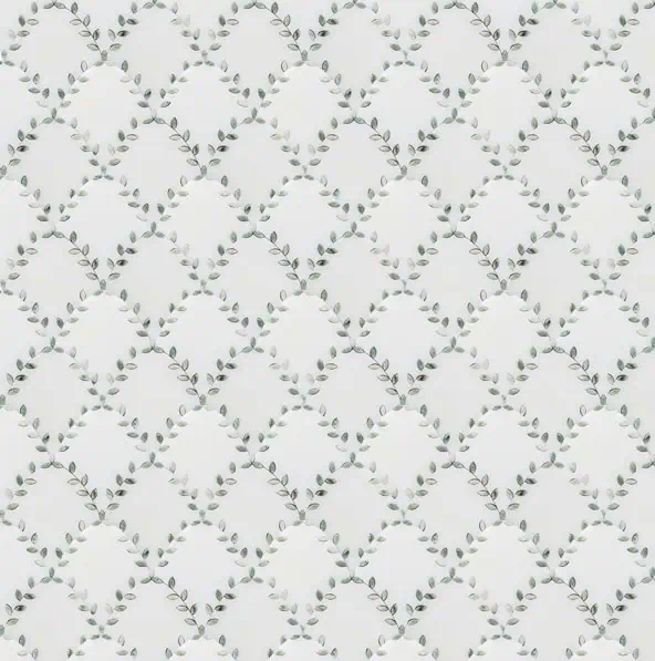 Delicate marble mosaic tile featuring an interwoven vine and leaf pattern in soft green tones on a white background, creating a serene and organic design.