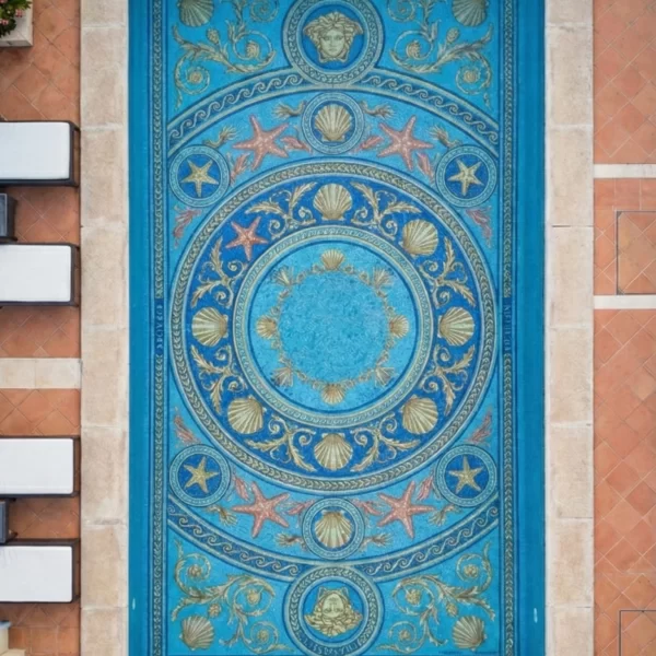 Starfish Pool Mosaic Medallion Marine pool mosaic with circular medallion, shell and starfish motifs, gold scrollwork, and blue tile base in luxury coastal pool design.