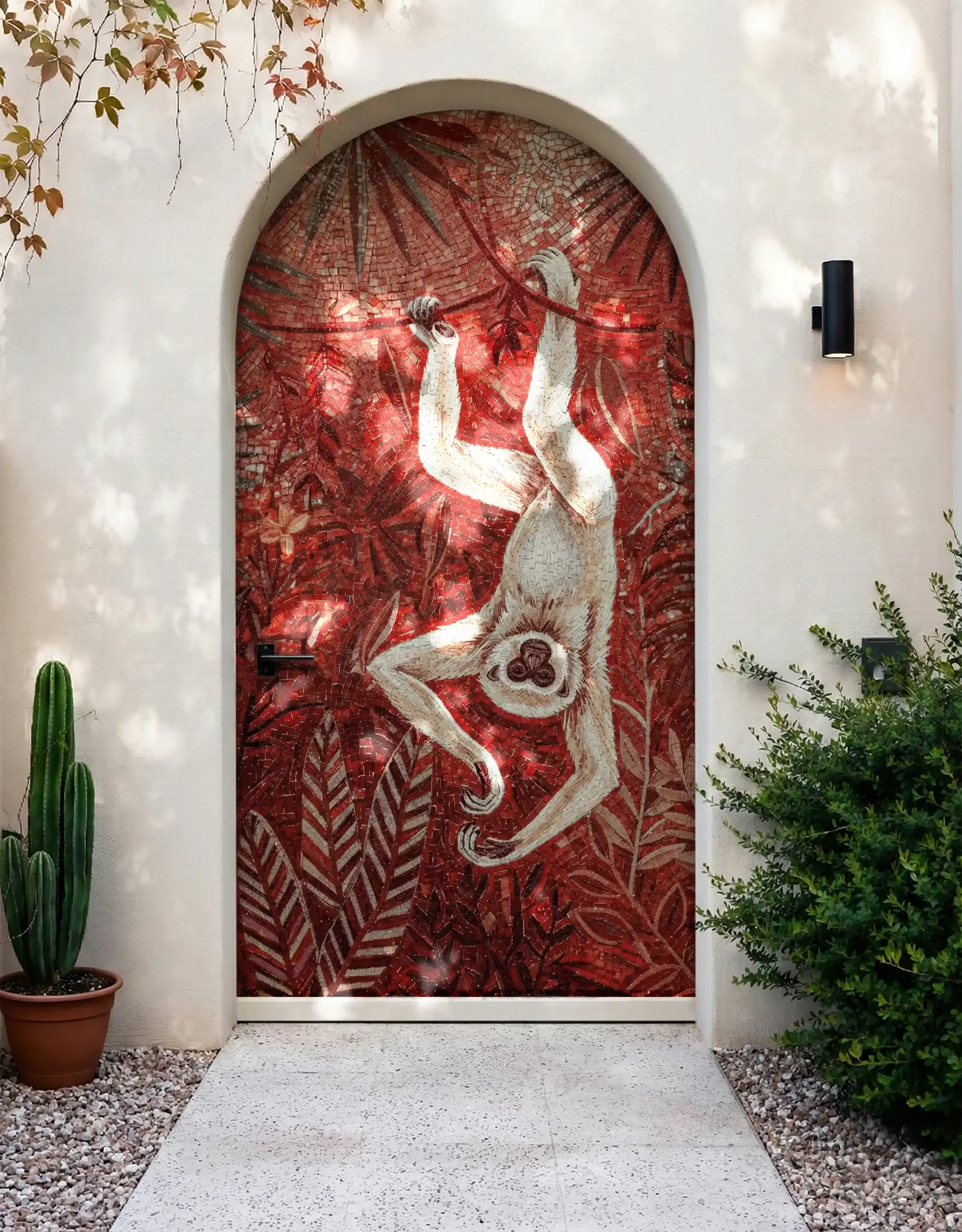 Crimson Canopy Wildlife Mosaic used as an arched exterior entry feature wall with handcrafted monkey and tropical foliage design.