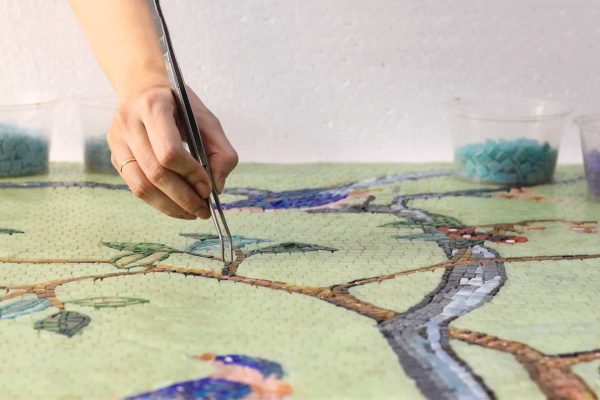 custom wallpaper-inspired peacock mosaic tile being fabricated by our mosaicists.